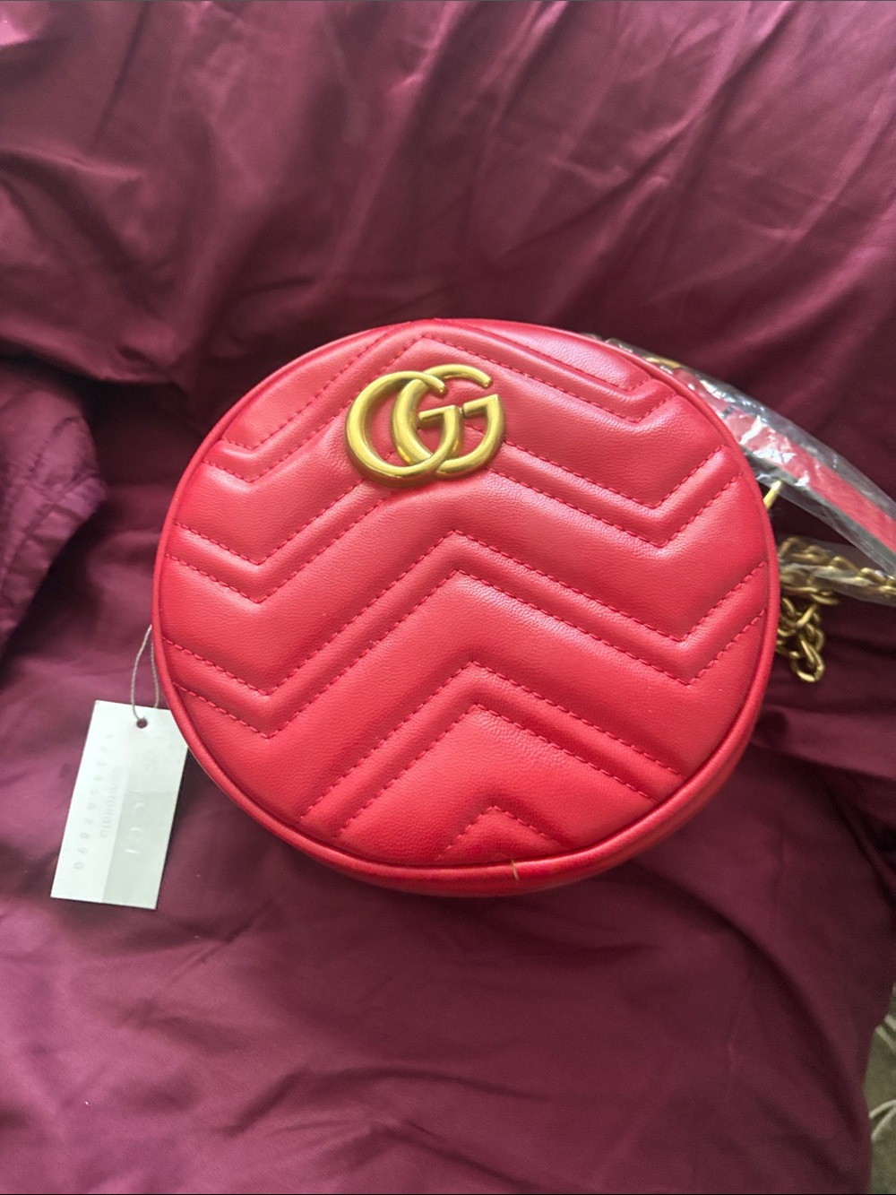 Red Quilted Round Crossbody Bag with Gold Hardware